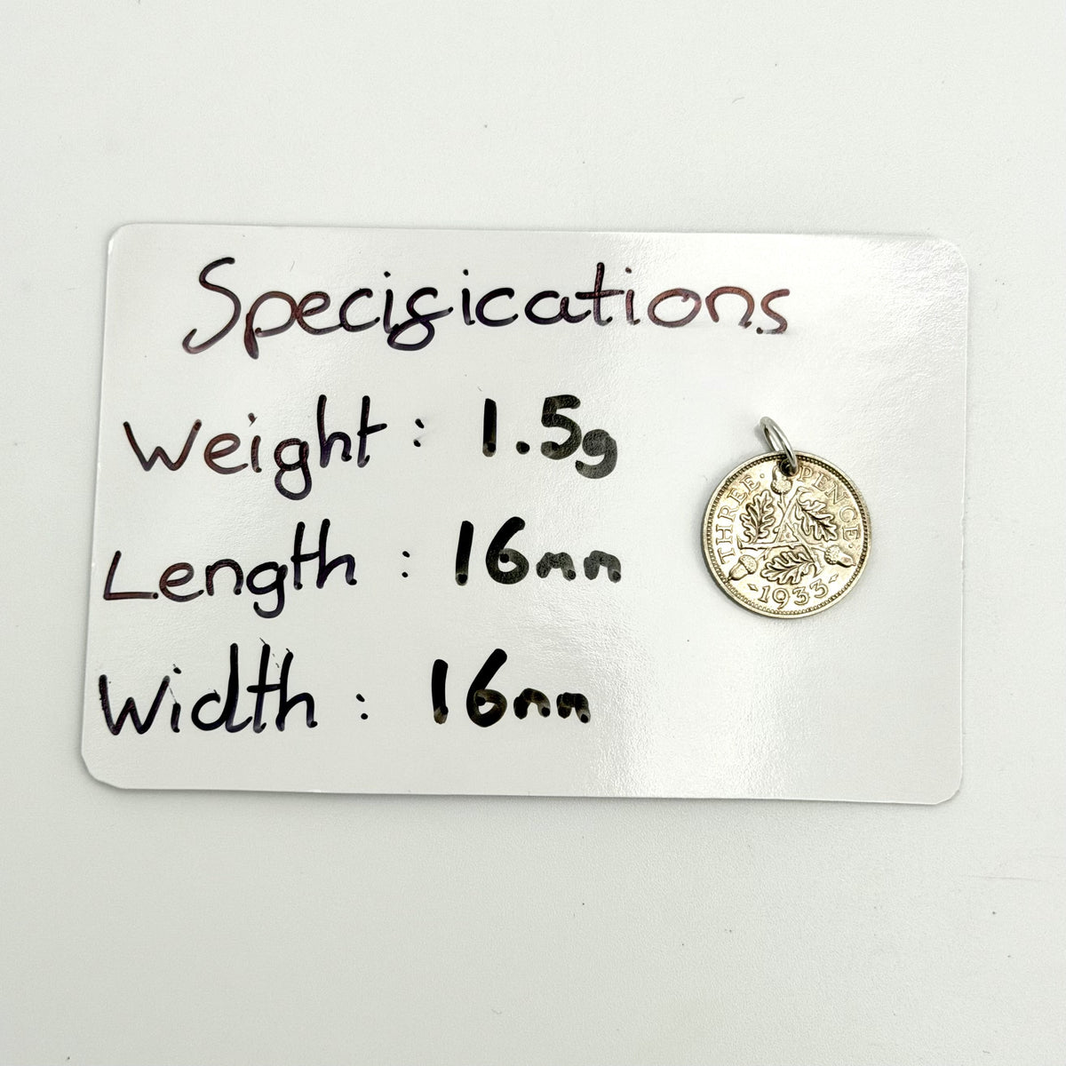 George V portrait on reverse of 1933 silver threepence coin charm