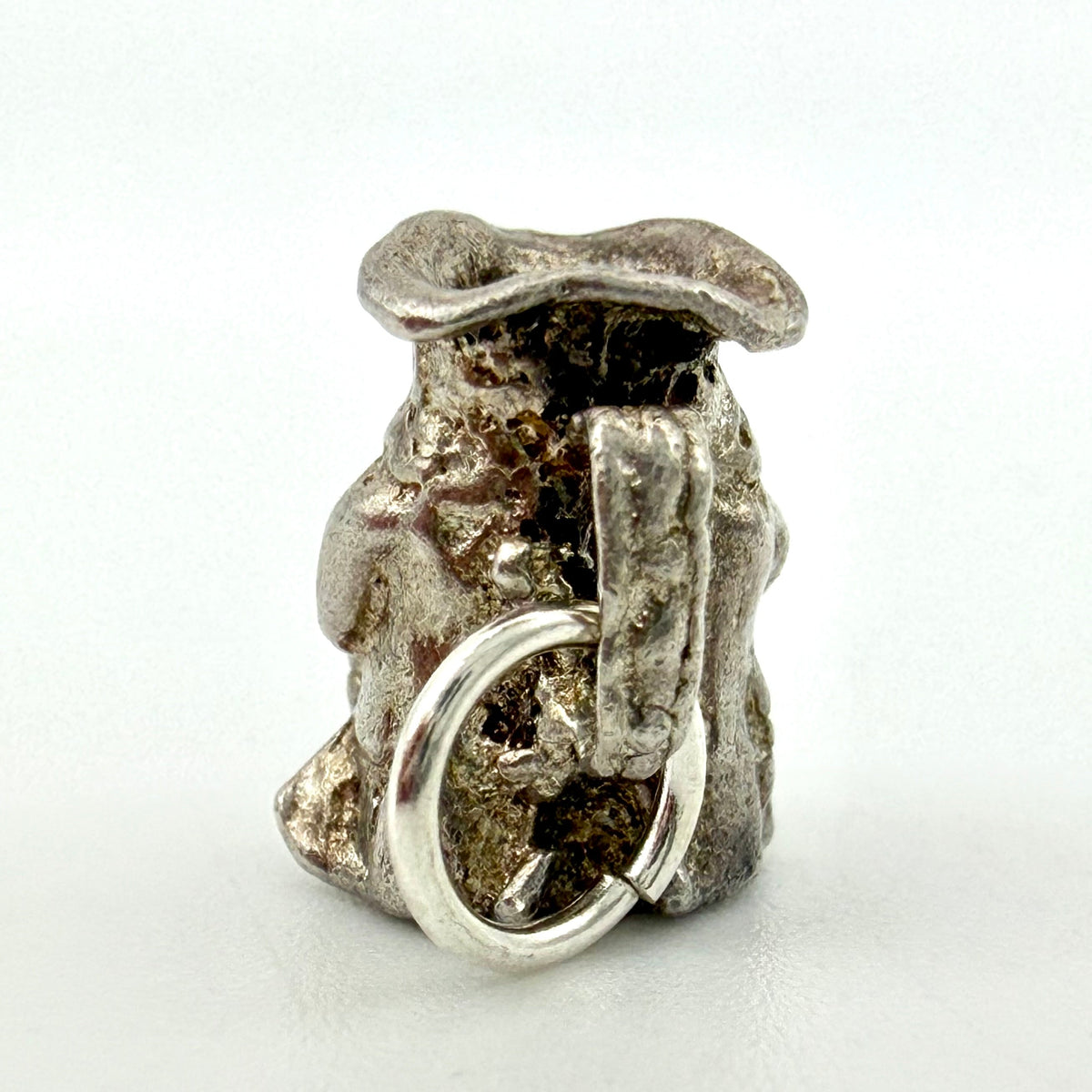 Vintage sterling silver Toby jug charm, front view of jug and figure