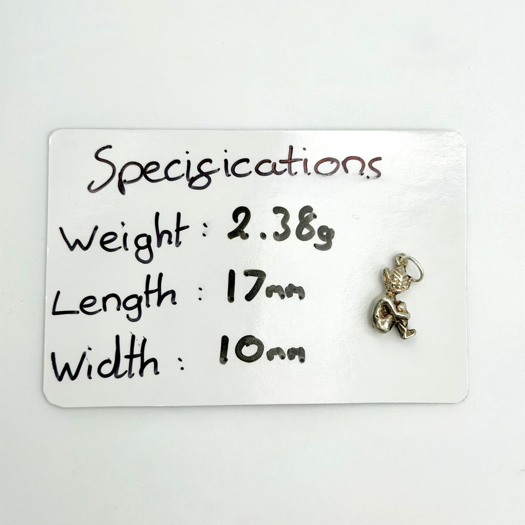 Front view of seated sterling silver imp pixie charm