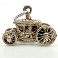 Side view of sterling silver Cinderella carriage charm with detailed windows and wheels