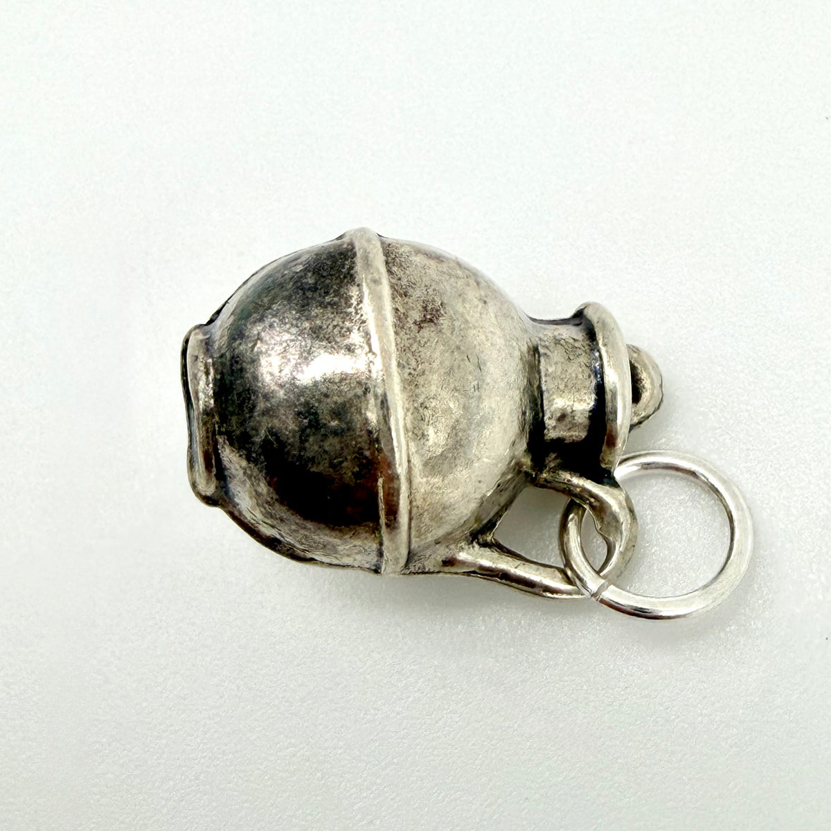 Front view of vintage sterling silver creamer jug charm with hanging ring