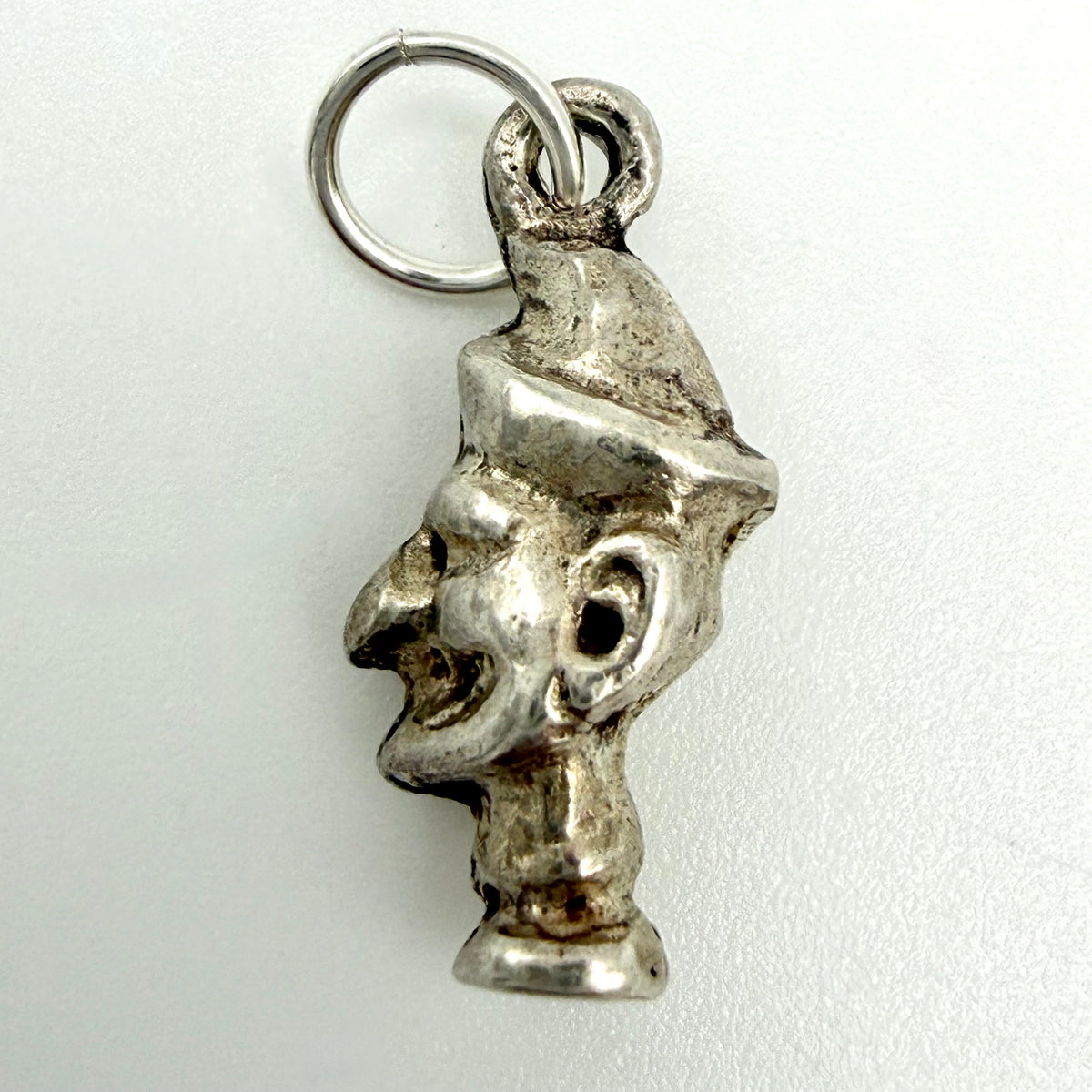 Close up of the reverse of the vintage Mr Punch charm