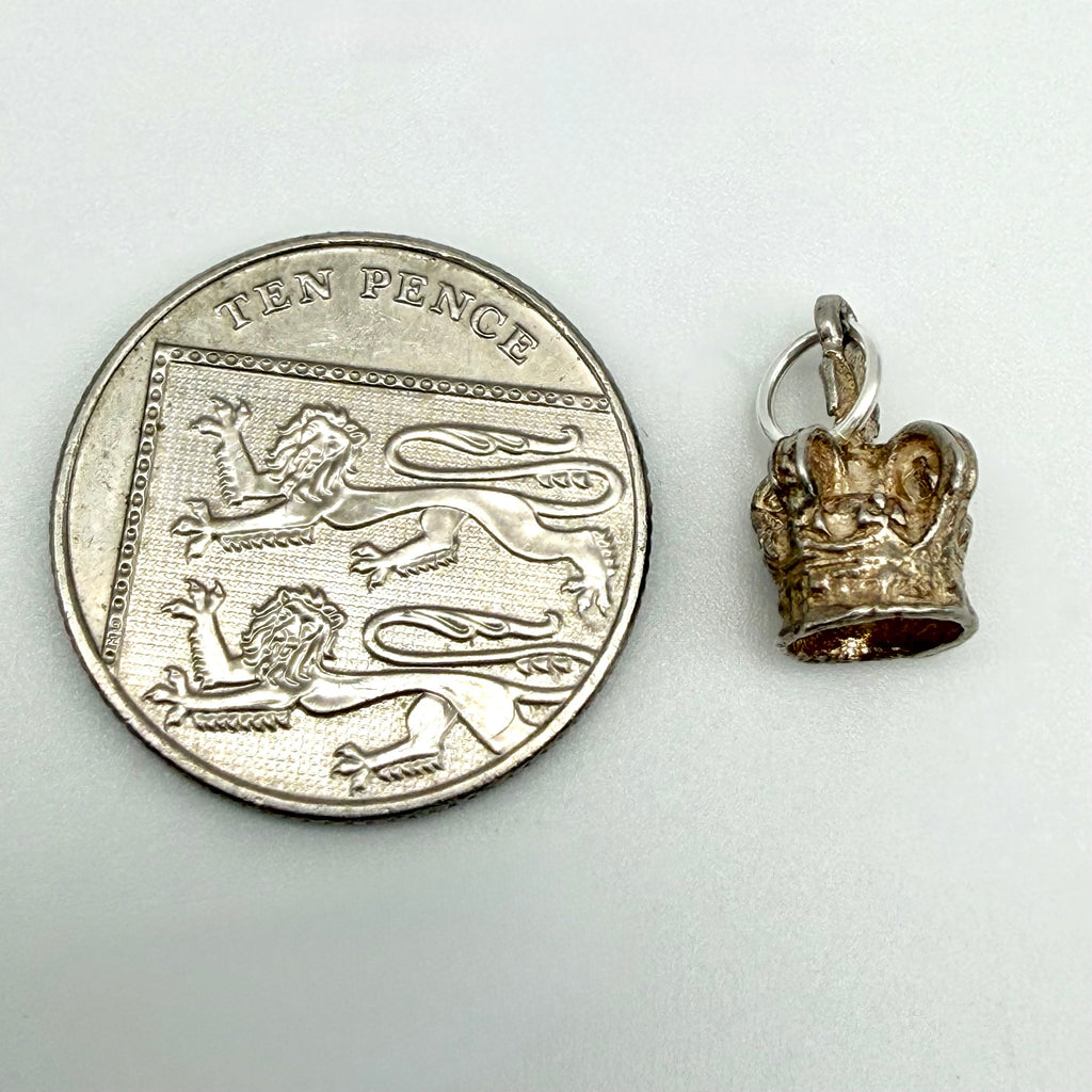 Front view of vintage sterling silver royal crown charm