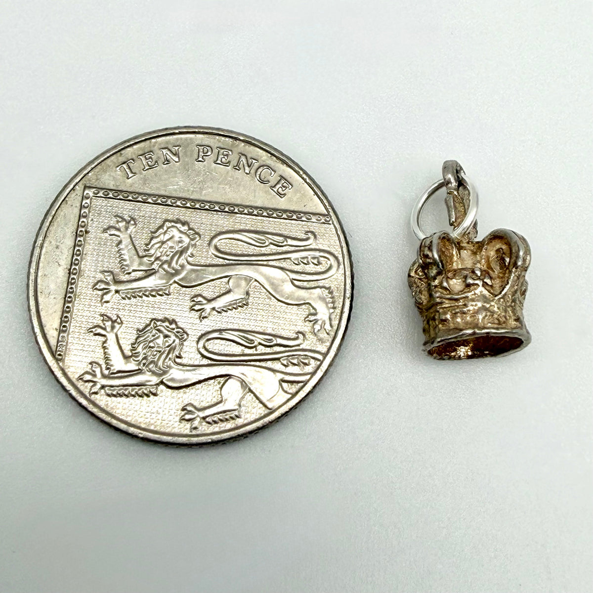 Front view of vintage sterling silver royal crown charm
