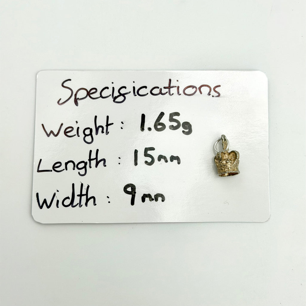 Rear view of crown charm showing open details and silver jump ring