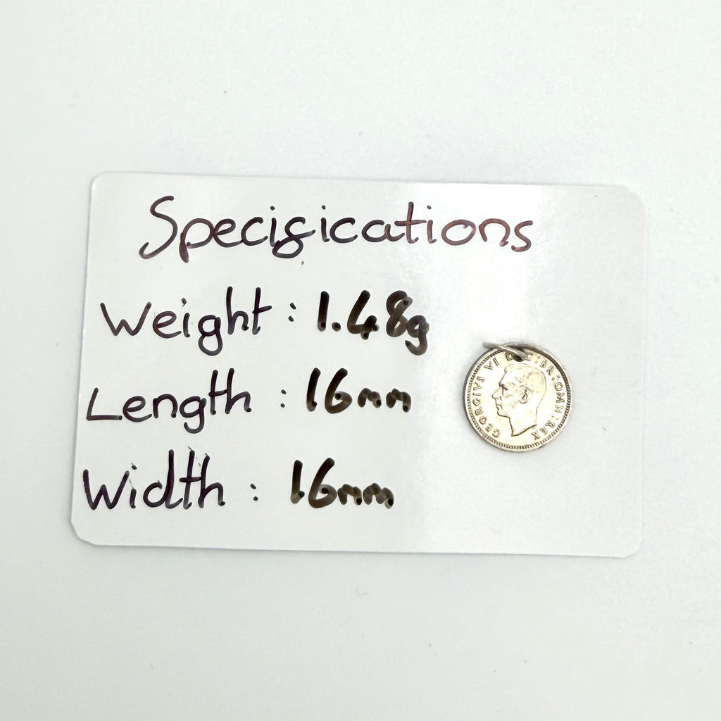 Close view of the 1940 threepence rose and shield design with hanging loop