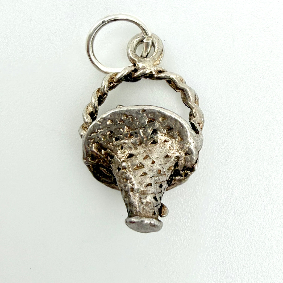 Vintage Sterling Silver Flower Basket Charm and a split ring, shown on a plain white background.