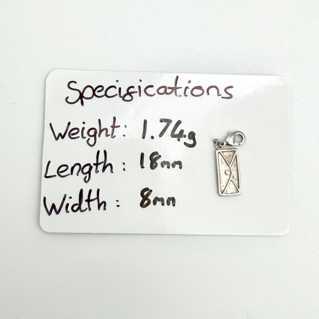 A small silver-toned rectangular pendant or charm with a loop at the top, shown next to a white card labeled 'Specifications' with handwritten measurements and weight.