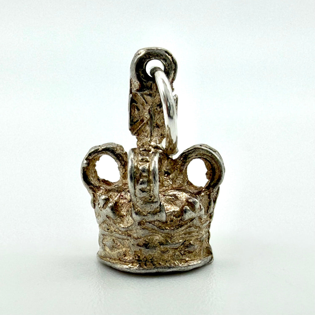 Back of vintage sterling silver crown charm showing the jump ring