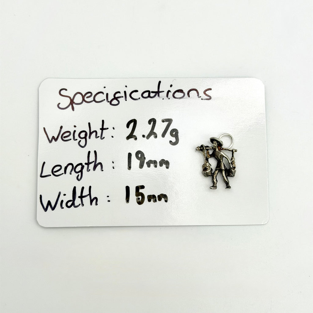 Angled reverse view of vintage silver water carrier charm and buckets
